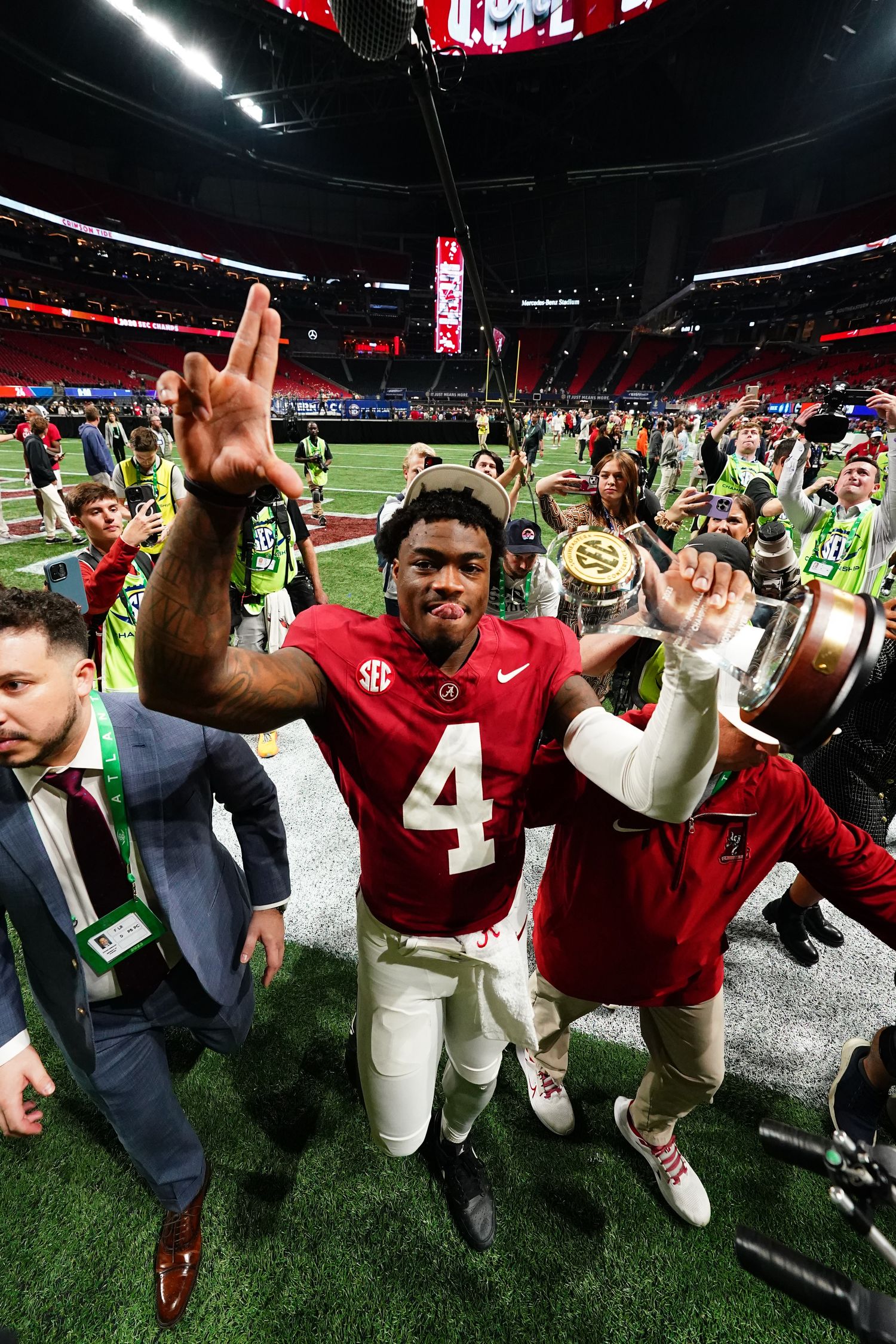 Alabama Crimson Tide quarterback Jalen Milroe (4) leaves the field after defeating the Georgia Bulldogs in the SEC Championship at Mercedes-Benz Stadium.